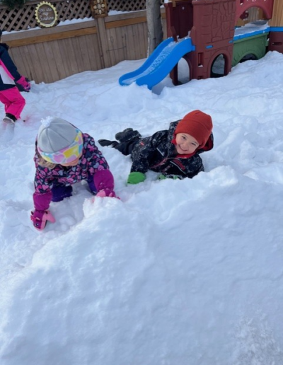 Coronation Montessori children playing outdoors in winter