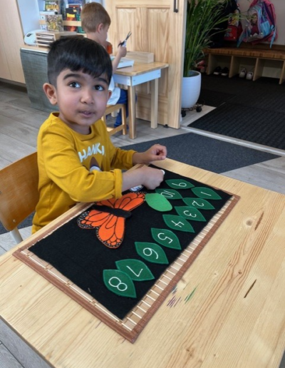 Coronation Montessori young boy counting game